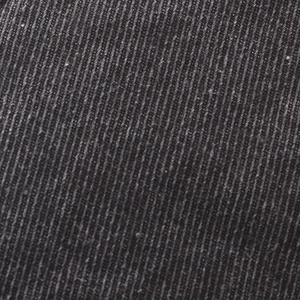 Close-up of the dark grey breathable cotton twill fabric texture on a flat cap