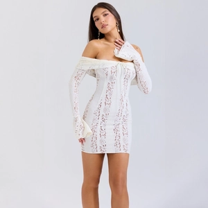 Detail of white lace off-shoulder dress with bow tie neckline and flared sleeves