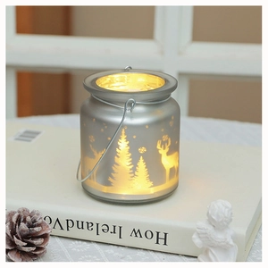 Frosted glass Christmas candle holder with reindeer forest pattern and metal handle
