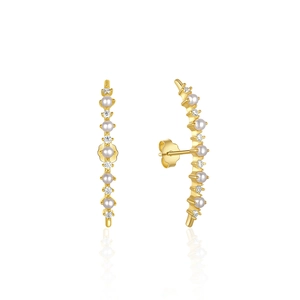 Detailed view of curved gold pearl earrings with sparkling cubic zirconia accents