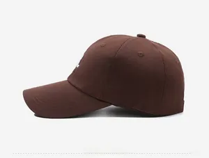 Side view of dark brown twill cotton baseball cap featuring white R embroidery detail