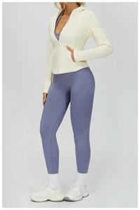 Close-up of women's warm fleece zip-up hoodie featuring side pockets and hooded detail