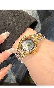 Macro detail of luxury women's quartz watch with diamond bezel and mother of pearl dial