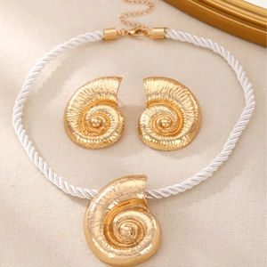 Bohemian style gold conch shell necklace and earrings set on white braided cord