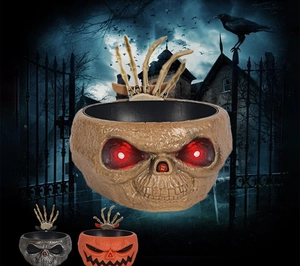 Animated Halloween candy bowl with glowing red eyes and moving skeleton hand