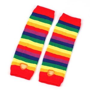 Detail of rainbow striped knit arm warmers with thumb holes and elastic ribbed cuffs