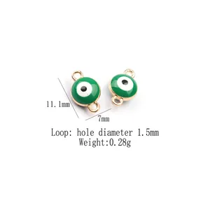Detail of green evil eye enamel charms with dimensions 11.1mm x 7mm and 1.5mm hole size