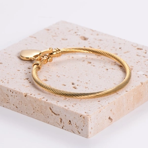 18k gold plated stainless steel 3mm cable wire bracelet featuring a heart pendant