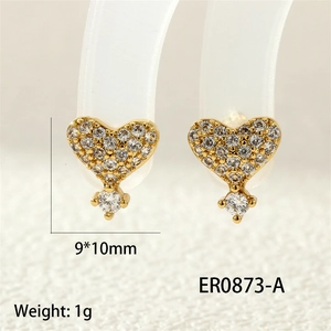 Macro shot of gold heart-shaped earrings with white zircon stones and 9x10mm size dimensions