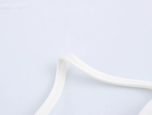 Close-up of the white satin strap detail with high-quality stitching on this elegant set