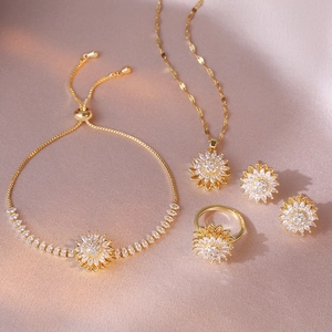 Golden sunflower jewelry set featuring sparkling zircon necklace, bracelet and ring