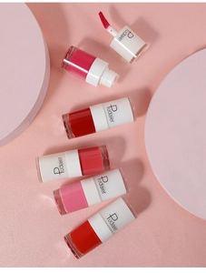 Close-up of velvet matte liquid lipsticks showing applicator brush and various shades