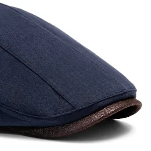 Men's cotton linen newsboy cap with vintage brown leather brim and navy blue fabric