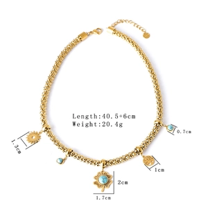 Gold stainless steel necklace with sun, turquoise beads, tree of life, and clover pendants