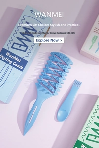 Hemelblauwe geventileerde haarborstel met reinigingshulpstuk en originele verpakking