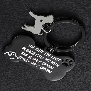Custom engraved black stainless steel bone and dog charm keychain set on leather
