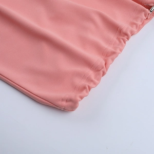 Detailed close-up of pink casual hoodie hem with elastic drawstring and double-needle stitching
