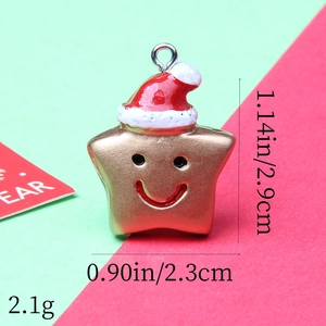 Macro view of a gold-tone star pendant with red Santa hat and dimensions for DIY jewelry