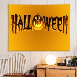 Detail of Halloween tapestry with 3D orange lettering and glowing pumpkin on white wall