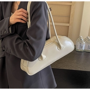 Large capacity off-white leather underarm bag with double slim shoulder straps on model