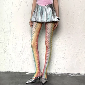 Rainbow gradient fishnet stockings with large mesh design shown on model for Y2K style