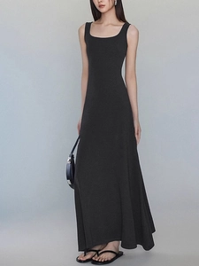 Close-up of black square neck sleeveless maxi dress with elegant slim fit and draped hem