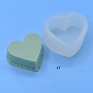 Heart-shaped silicone mold with finished cake product on light blue background