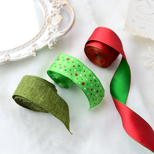 Red and green Christmas ribbon collection with dots and texture on white plush background