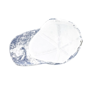 Detail view of cotton inner lining and adjustable buckle of blue tie-dye baseball cap