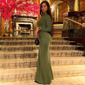 Detail of elegant olive green slim fit long sleeve maxi dress with ruching accents