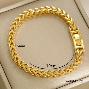 Detailed view of a 5mm golden wheat chain bracelet with a heavy-duty box clasp closure