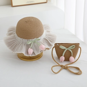 Detail view of girls' straw hat and matching bag with tulip and lace trim