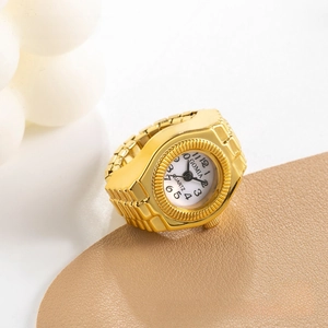 Detail view of gold alloy ring watch with white dial and flexible expandable band