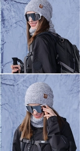 Close-up of winter knit hat and neck warmer with leather logo for outdoor activities