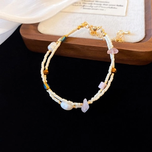Double-layered beaded bracelet with freshwater pearls and natural stones on gold plating
