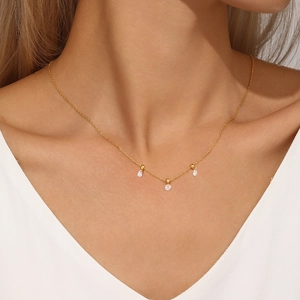 Detail of adjustable S925 sterling silver gold necklace with three zircon pendants on neck