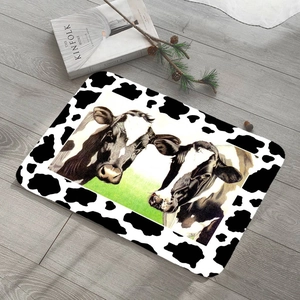 Absorbent dairy cow print doormat featuring realistic cows on rustic wood background