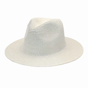 Detail of woven white straw sun hat featuring shimmering silver thread and fedora style