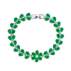 Elegant silver flower bracelet with green teardrop zircon stones on a white background