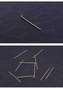Macro view of gold stainless steel flat head pins for DIY jewelry making accessories