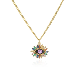 Macro shot of 18K gold plated evil eye pendant with multicolored baguette gemstones