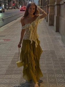 Fashionable cream lace off-shoulder ruffled top with layered olive green maxi skirt