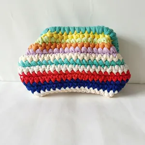 Detailed view of rainbow crochet cloud bag featuring handmade knit fabric texture