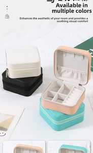 Macro detail of portable jewelry box with cross-pattern leather and velvet lining