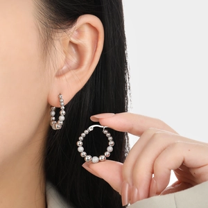Minimalist titanium steel beaded hoop earrings featuring polished and frosted spheres