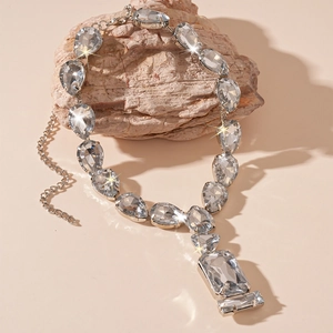 Luxury silver-toned necklace with pear and rectangular cut clear crystals on stone