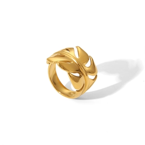 Detail of gold monstera leaf ring featuring intricate hollow patterns and polished metal