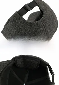 Dettaglio cappellino grigio con cinturino regolabile e trama della cucitura interna