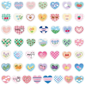 Detail view of assorted heart stickers with cute rainbow, fruit and animal patterns