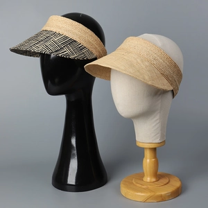 Wide brim raffia straw sun visors in geometric patterns and solid natural weave